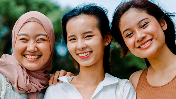 a young lady with a bright, radiant smile, showcasing her transformation from yellow teeth to sparkling white